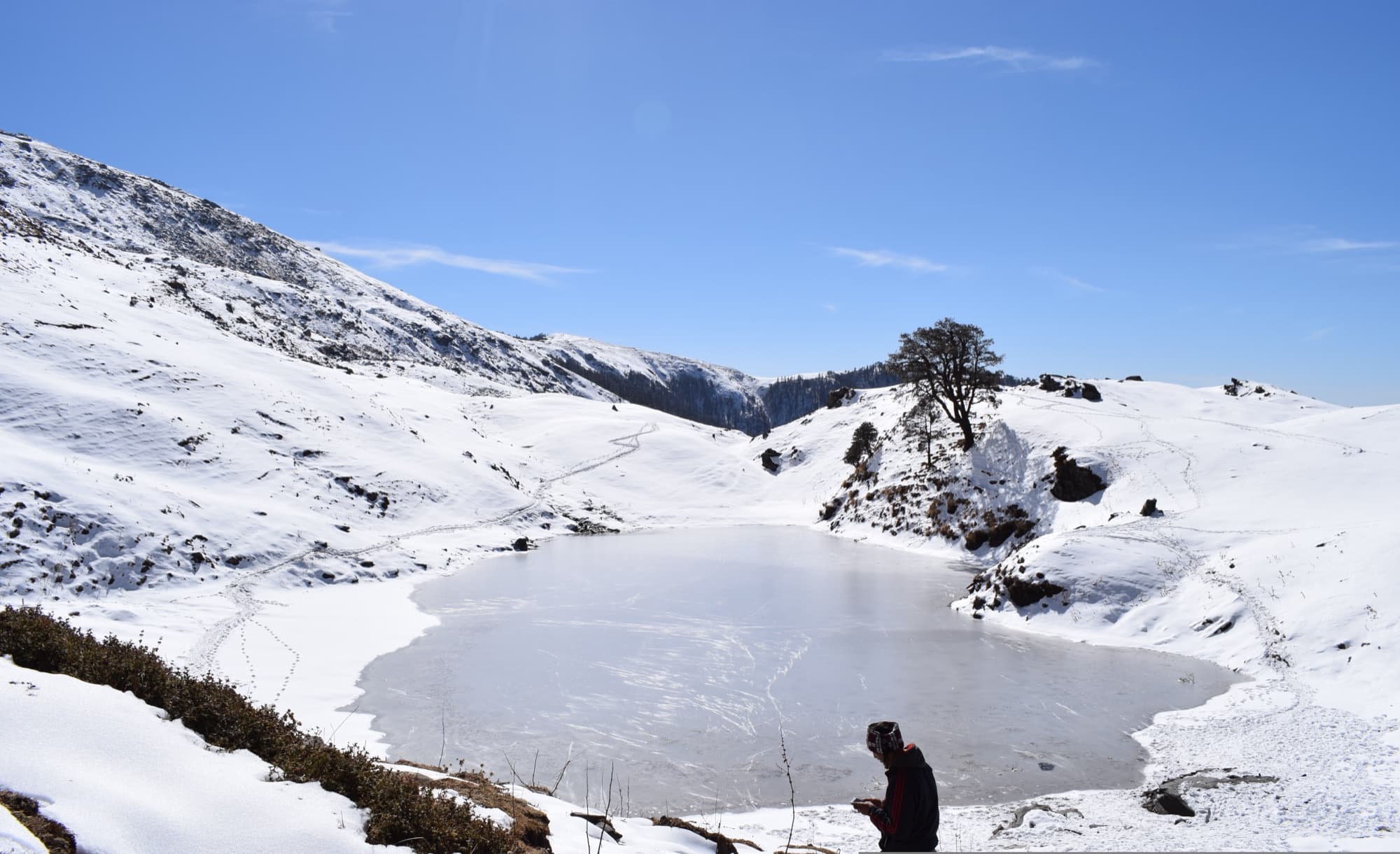 Brahmatal lake frozen in a snow-covered bowl in winter