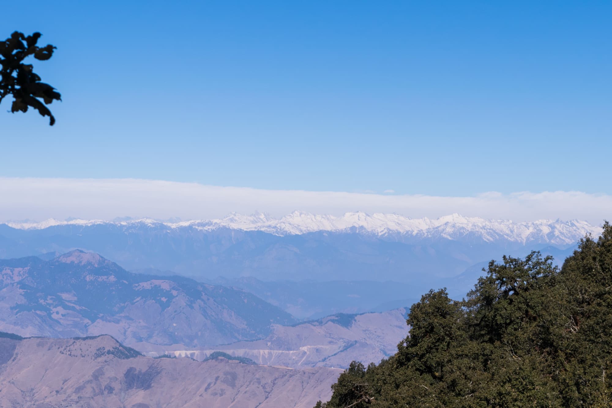 The Bandarpunch range beyond layered hills, from Nag Tibba