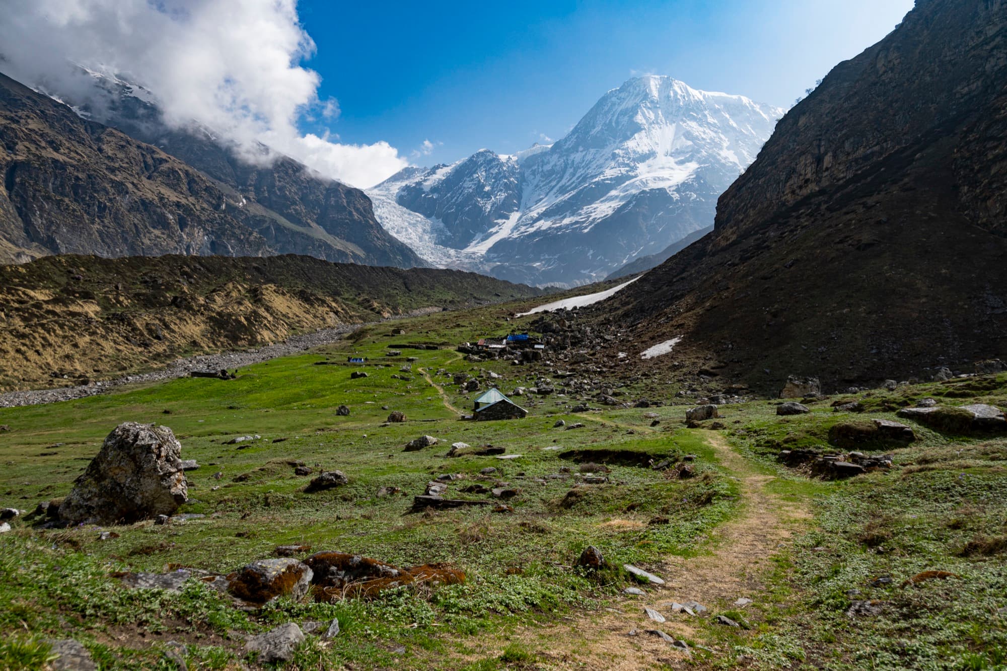 A trail through a boulder meadow towards the Pindari glacier
