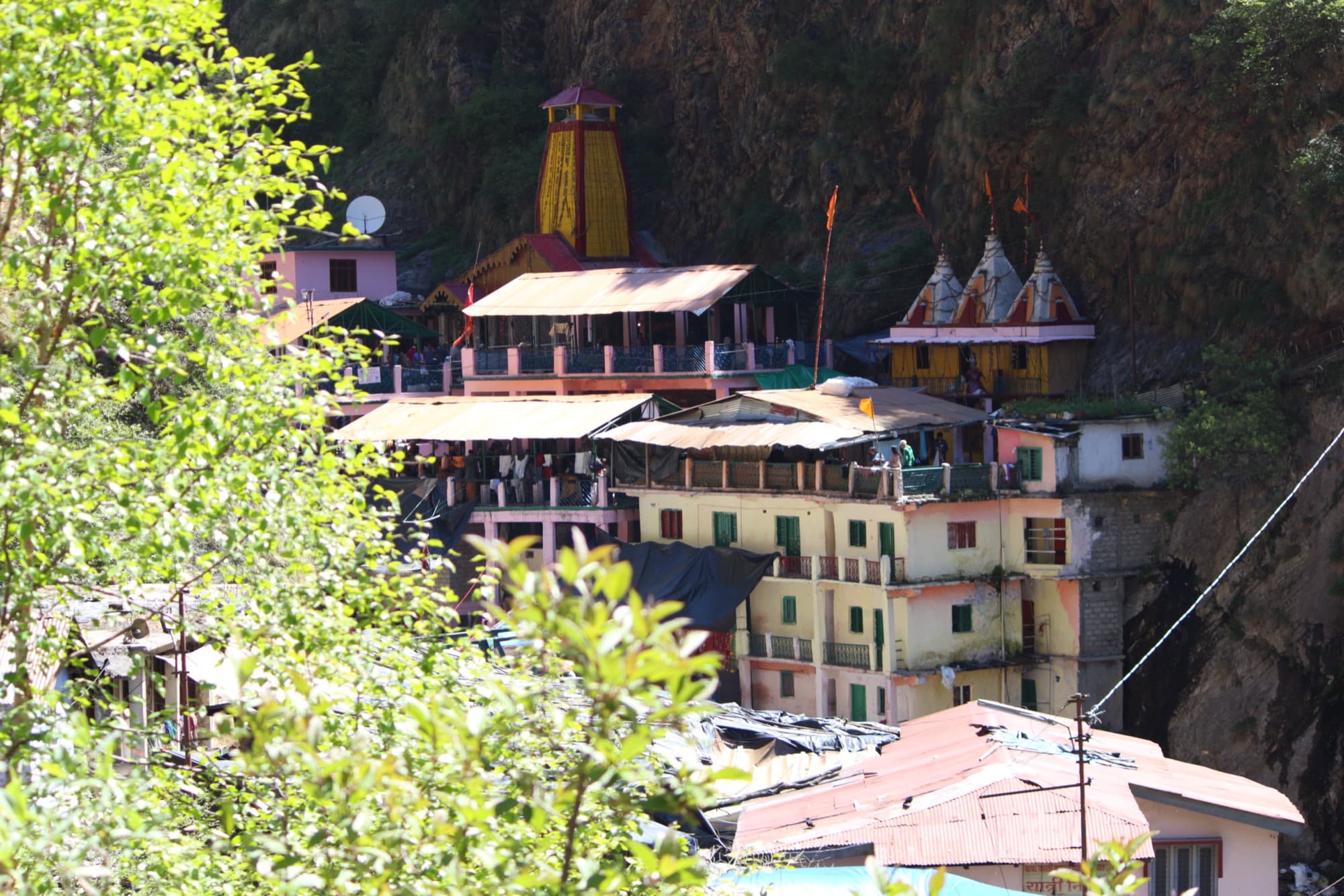 Yamunotri temple’s yellow spire against a rock face